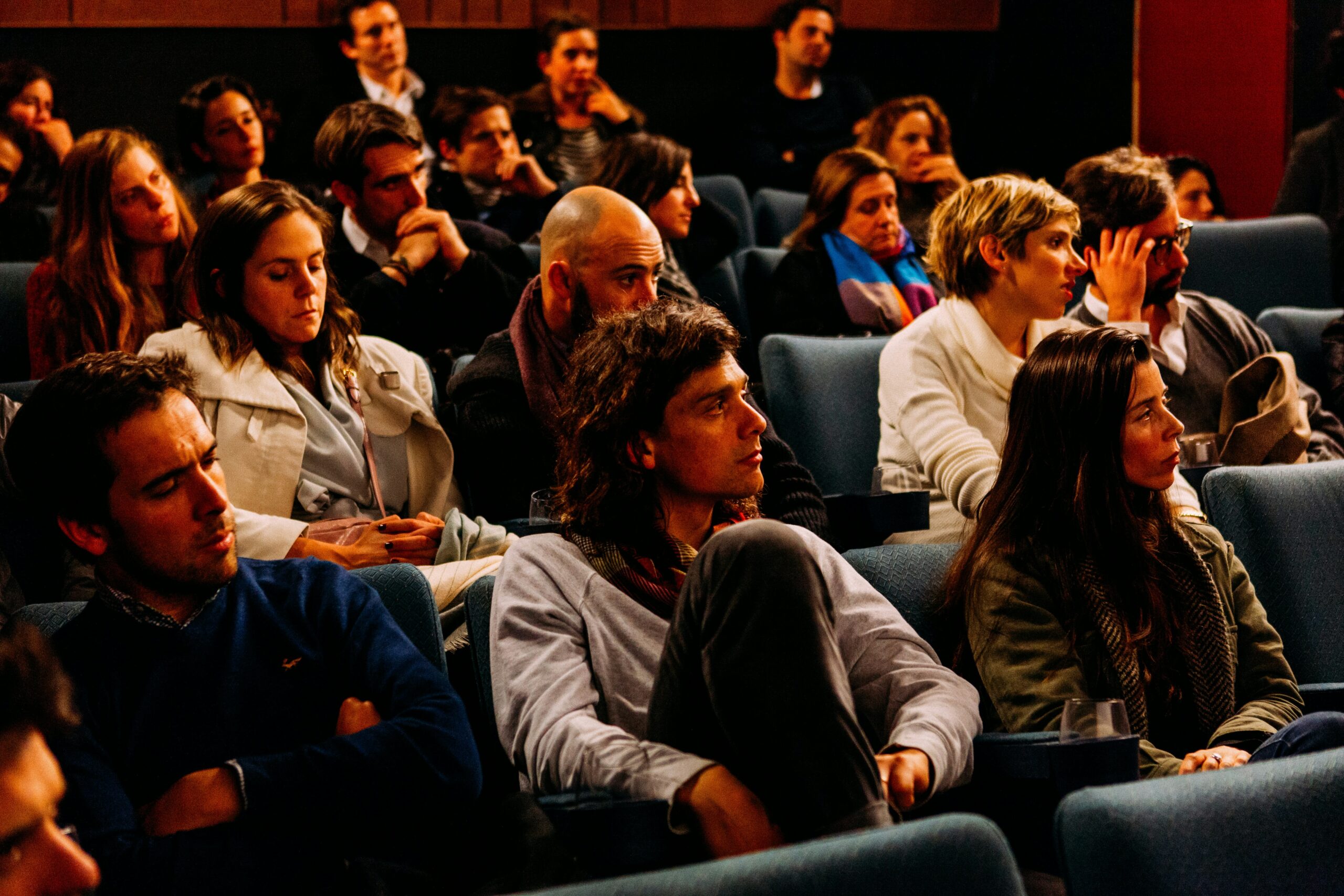 A group of adults in an audience.