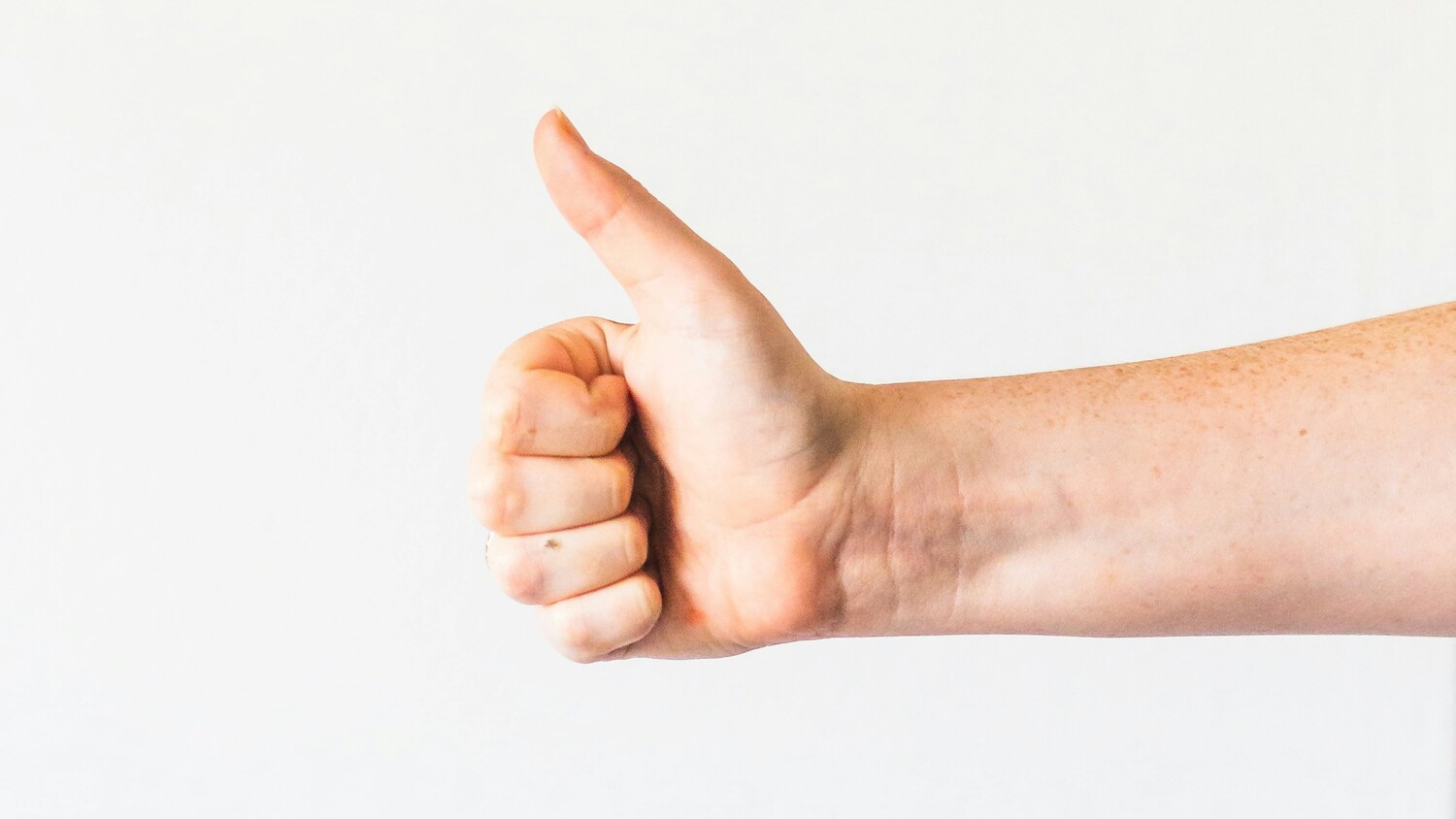 A hand giving thumbs-up.
